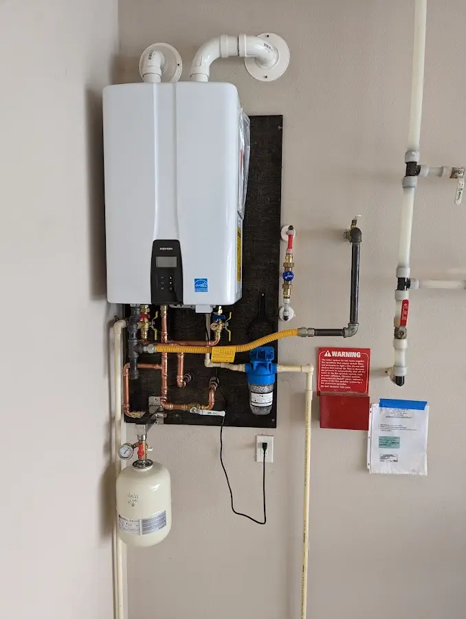 Professional plumber installing copper piping in a Pinetop-Lakeside home